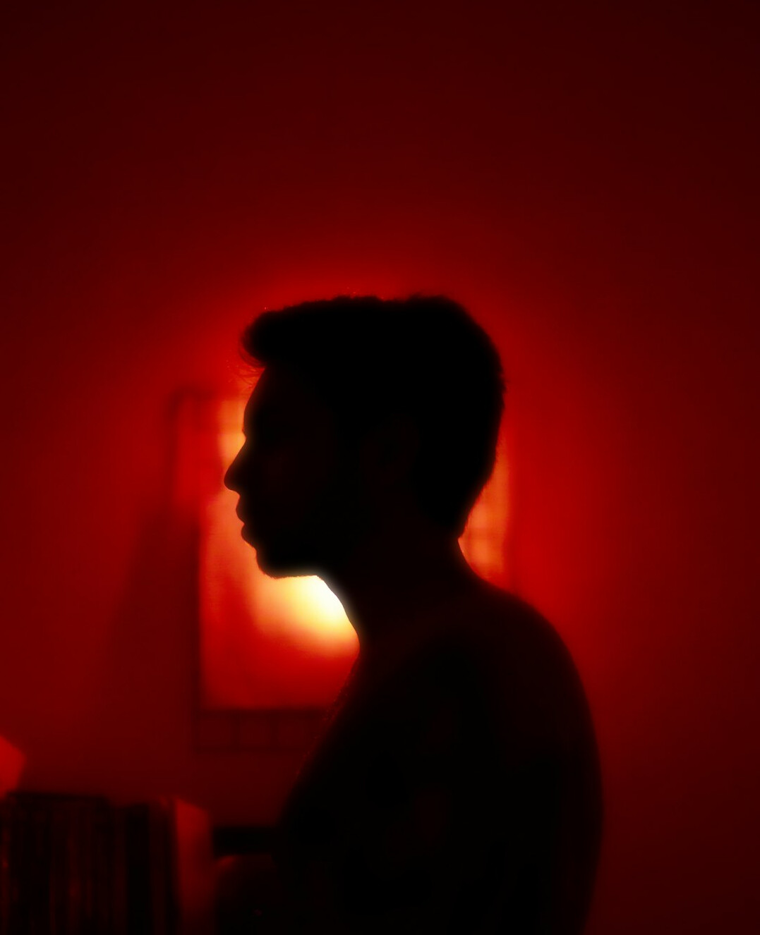 shadowy figure in dark room